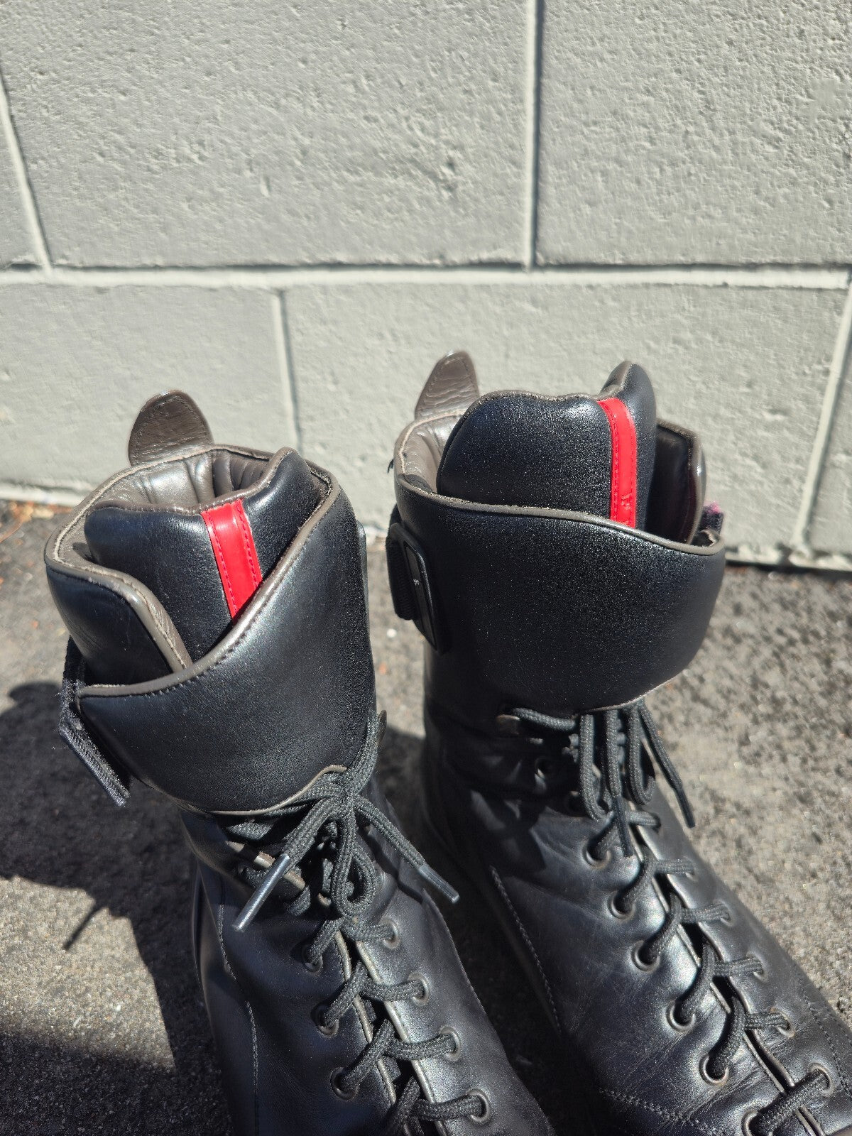 Prada Lace-up Leather Moto Combat Boots with Red Accent