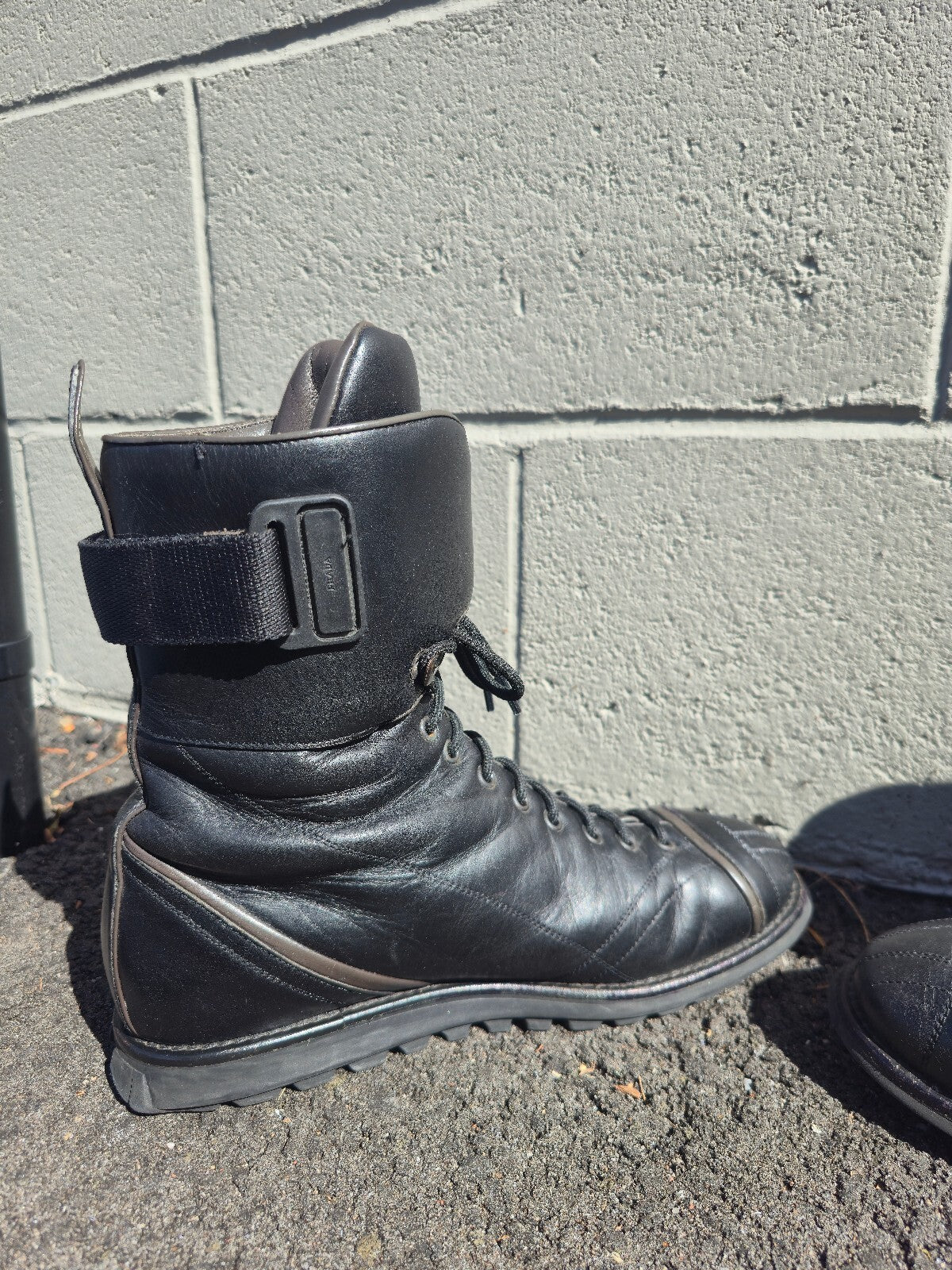 Prada Lace-up Leather Moto Combat Boots with Red Accent