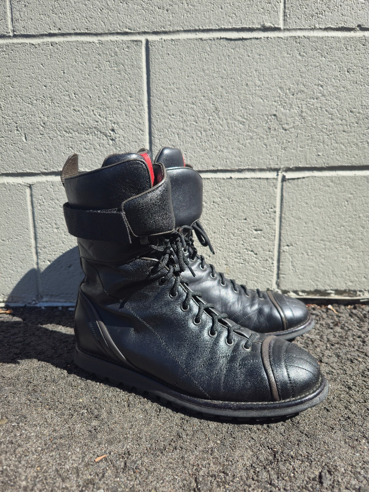 Prada Lace-up Leather Moto Combat Boots with Red Accent