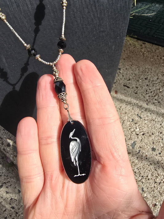 Antique crane intaglio made from stunning black glass on long metallic bead and black glass chain