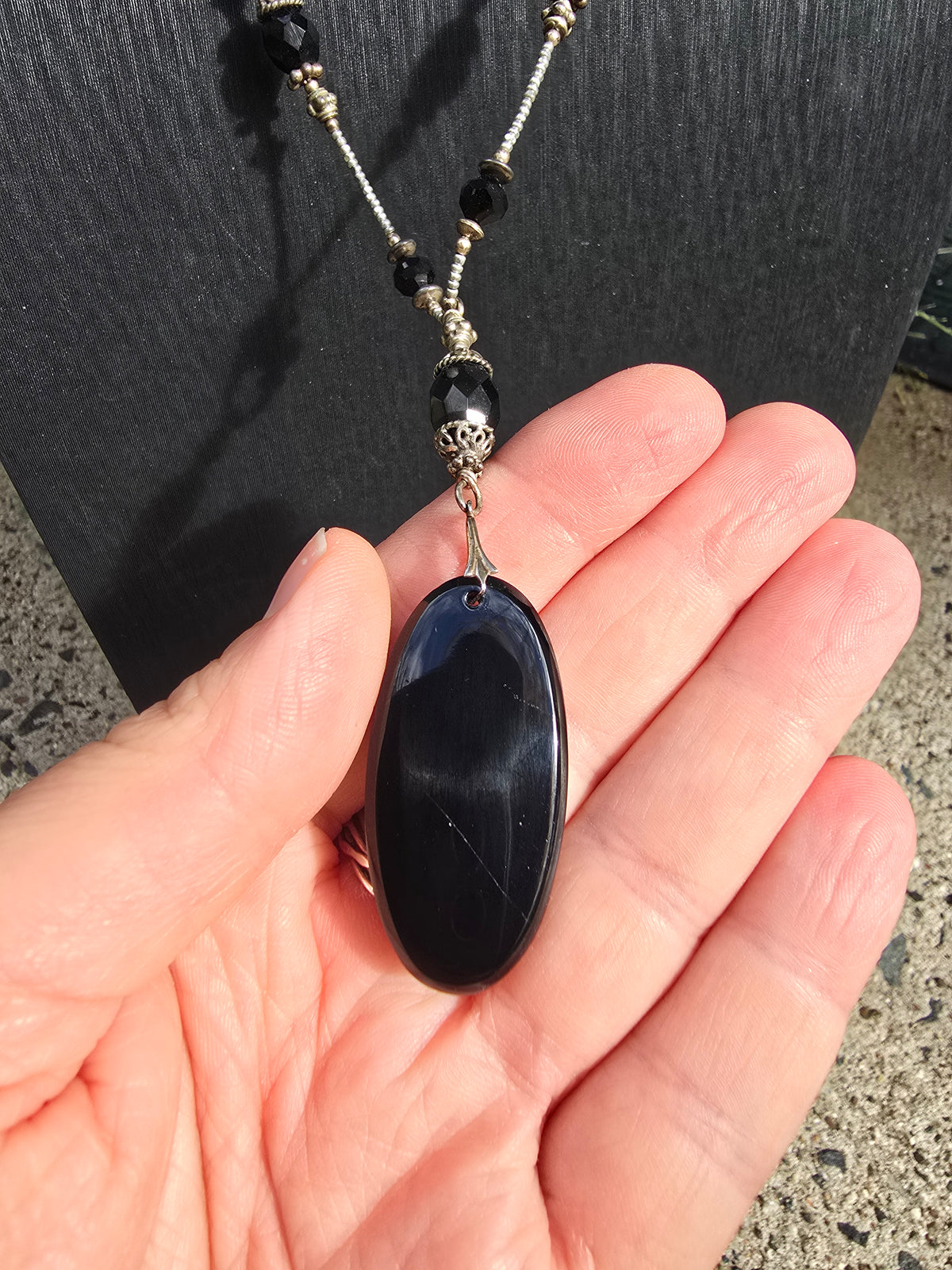 Antique crane intaglio made from stunning black glass on long metallic bead and black glass chain